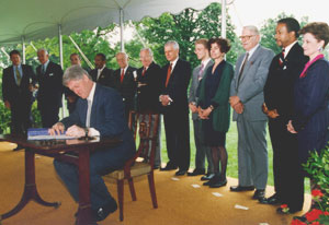 President Bill Clinton signing the National Voter Registration Act of 1993 on the South Lawn